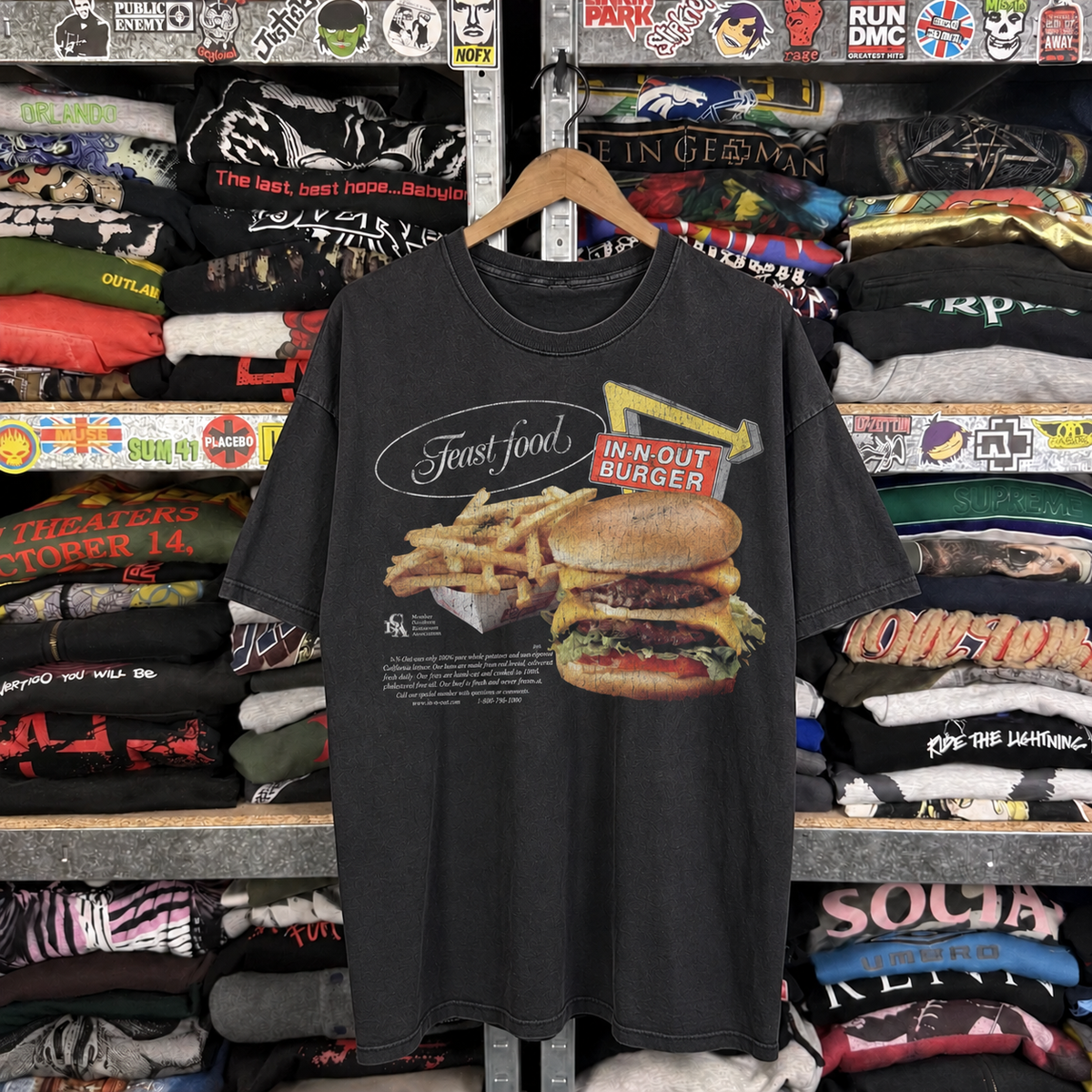 Feast Food 90's In-n-Out Promo Vintage Washed Black T-Shirt — off-body front on wooden hanger