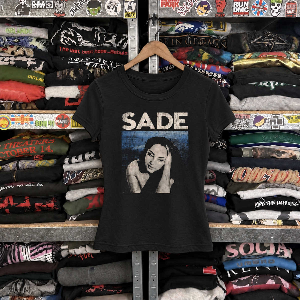 Rare Sade Portrait Womens Black Tee — off-body front on wooden hanger