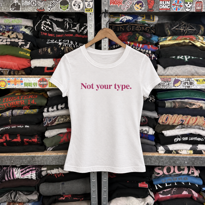 Y2K Not Your Type Womens Statement Tee — off-body front on wooden hanger